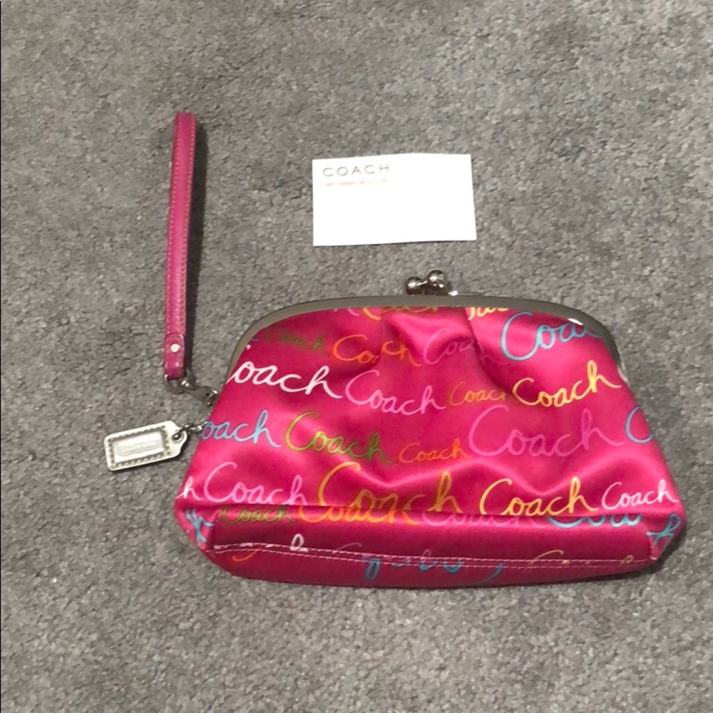 Coach wristlet/clutch. Hot pink, rainbow writing.
